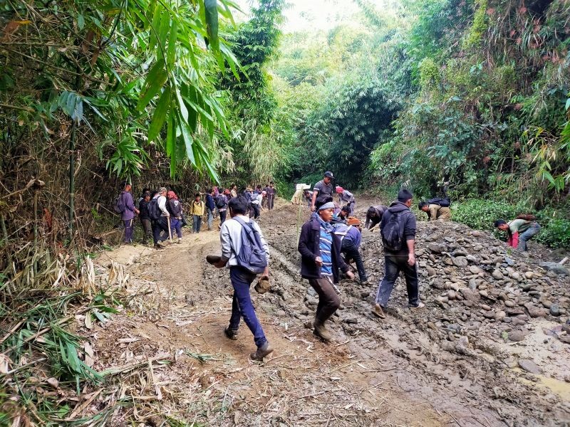 Villagers led by Nsong Area Frontal Organization undertook a community initiative to repair a 31km stretch of the much neglected Tening-Lekie Road from January 11 to 19. (Photo Courtesy: Aakam Pame)